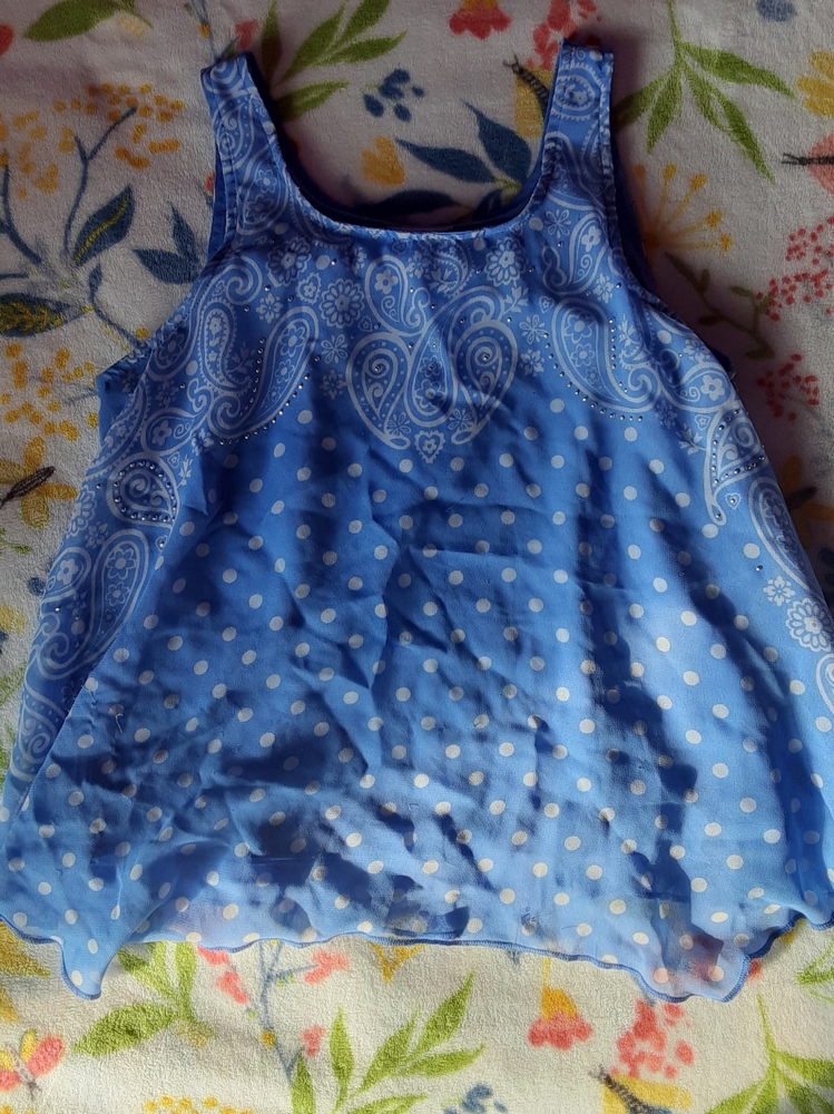 A blue & White pokadoted tank top. Brand Justice